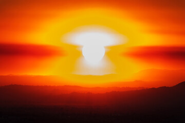 Apocalyptic sunrise as sun burns through disaster smoke cloud from the Eaton fire in Altadena.   Viewed from the Chatsworth neighborhood in Los Angeles, California.