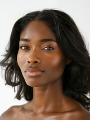 Obraz premium African American woman with sleek glossy hair in soft waves and natural makeup look on her full lips