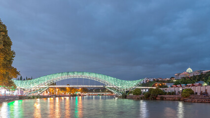 Bridge of Peace day to night timelapse, a bow-shaped pedestrian bridge in Tbilisi, Georgia © HyperlapsePro
