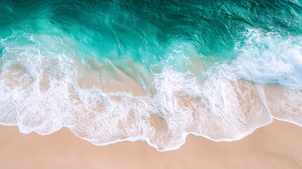 Obraz premium Stunning aerial view of turquoise ocean waves crashing on sandy beach sea foam blue calm water coast