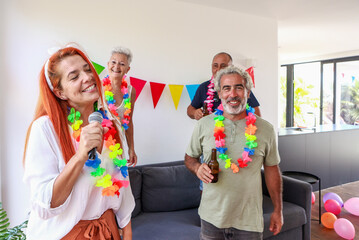 Joyful seniors enjoying a themed party with singing and decorations