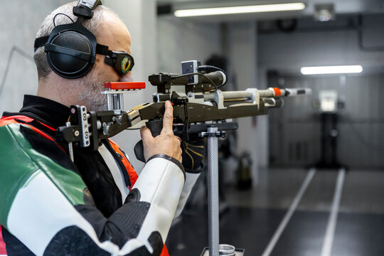 Blind Paralympic Shooter Aiming at Target in Training Session