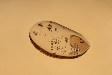 Close-up anti aging face serum with golden particles