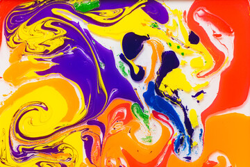 Vibrant abstract color swirls on a smooth surface