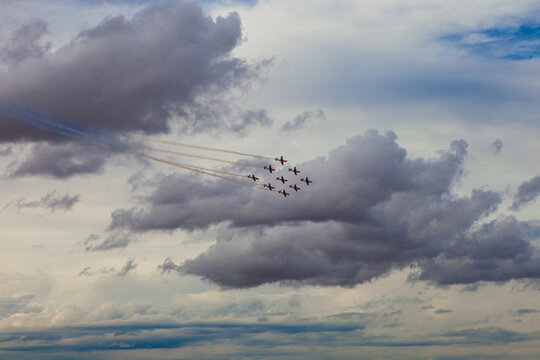 Aerobatic Jets Performing in Cloudy Sky Over Torrejon Air Base