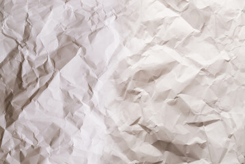 Crumpled white paper background.