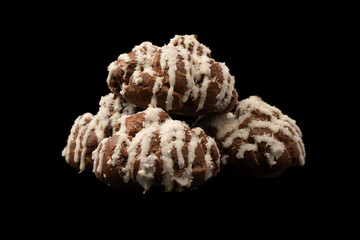 Profiteroles with coconut cream on a black background.