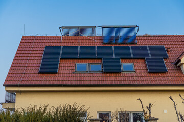 Solar panels on the roof of a building, solar water heating panels.