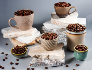 Fresh coffee beans in a mug and background.