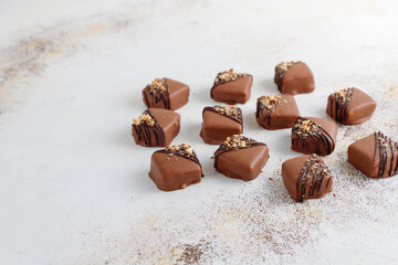 Handmade chocolate with pistachios, dark and milk chocolate pieces.