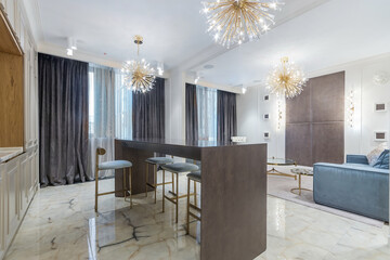 Exclusive kitchen design. Amazing chandeliers, stylish furniture. Marble floor tiles.