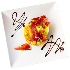 Restaurant serves traditional Spanish dish - vegetable casserole and bacon. Food is made from...