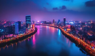 Naklejka premium Dramatic aerial view of a glowing cityscape at night with neon lights reflecting on a calm river, creating a futuristic and dynamic urban scene