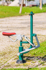 Public exercise machine in a park designed for outdoor fitness.