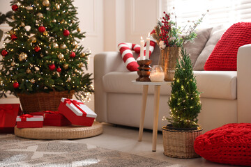 Beautiful Christmas tree and other decor in room. Festive interior design