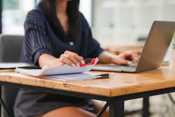 Woman Stamping Documents at Desk