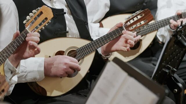 Musicians Playing Traditional Dalmatian Mandolins in slow motion in Croatia During a Live Performance, Close-up