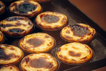 Traditional Portuguese dessert pasteis de nata, served fresh in Lisbon