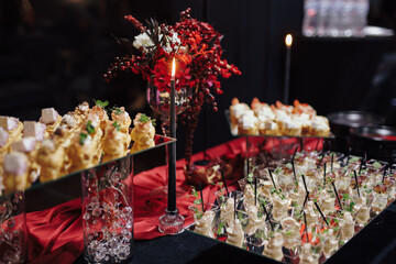 A buffet at an event with red decor