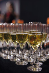 A row of champagne on the table