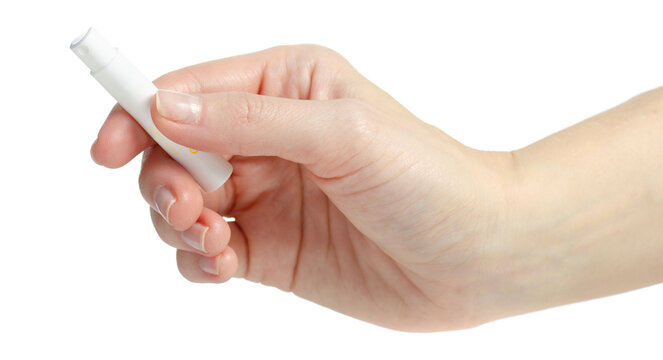 Hand holding perfume sampler on white background isolation