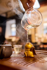 The Tea Ceremony Process is beautifully highlighted with exquisite pots and elegant glassware