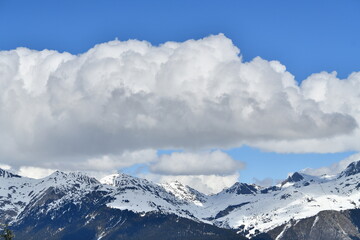 Fototapeta premium Amazing French alps by winter under snow and clouds