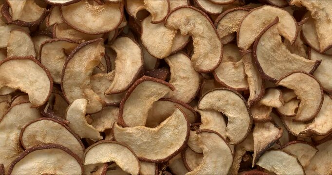 Top view of dried Asian pears background texture. Table spin. 