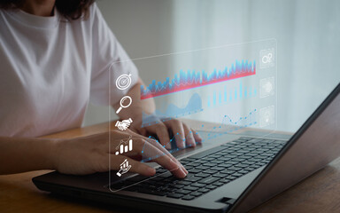 An analyst uses a computer and dashboard for data business analysis. Data Management System with...