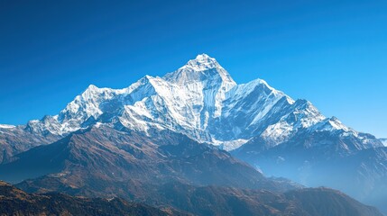 Fototapeta premium Majestic snow capped mountain range landscape under a clear blue sky