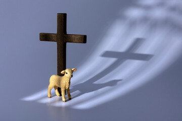 Lamb of God Standing Next to Wooden Christian Cross with Church Window Shadow © Tosh Lubek