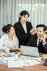 Diverse group of business analyst team analyzing financial data report paper on office table. Chart and graph dashboard by business intelligence analysis for strategic marketing planning Meticulous