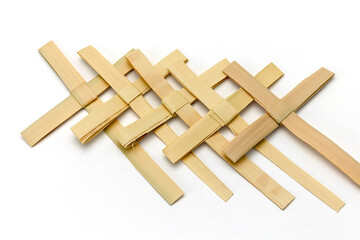 Palm Cross Isolated on White Background: Palm Sunday Symbol of Christian Faith in Forgiveness of since and Christ's Passion
