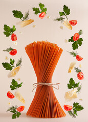 Red tomato pasta, uncooked, stands on the table surrounded by products flying around: tomatoes, cheese, garlic, herbs. Ingredients are isolated on a pink background.
