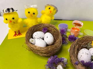 Easter eggs in a basket decorated with flowers and decor