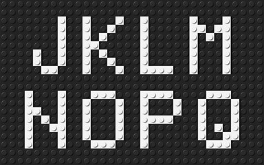 Letters of the alphabet composed of white plastic brick toy blocks on black building plate background. Building bricks font. Vector background illustration