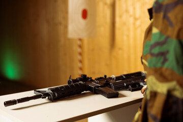 Army soldier doing intensive shooting course designed to elevate individual skills beyond basic marksmanship. Close up of rifle used to engage targets of different sizes at various ranges