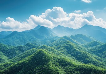 Obraz premium Lush Green Mountain Landscape Under Bright Blue Sky with Fluffy Clouds and Expansive Views of Nature's Serenity and Majestic Peaks