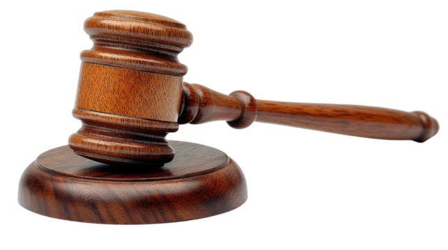 Gavel of Justice: A close-up shot of a polished wooden gavel resting on its sound block, symbolizing law, order, and judicial proceedings. 