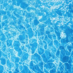 Obraz premium Tranquil surface of sparkling blue pool water with sunlight reflections