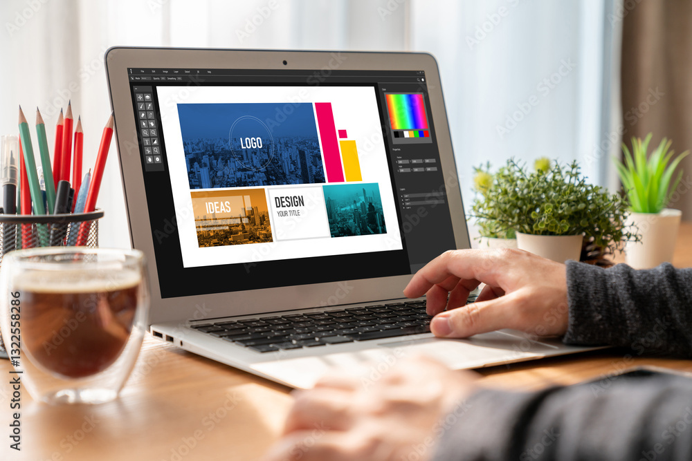 Poster graphic designer software for modern design of web page and commercial ads showing on the computer s