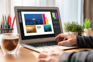 Graphic designer software for modern design of web page and commercial ads showing on the computer...