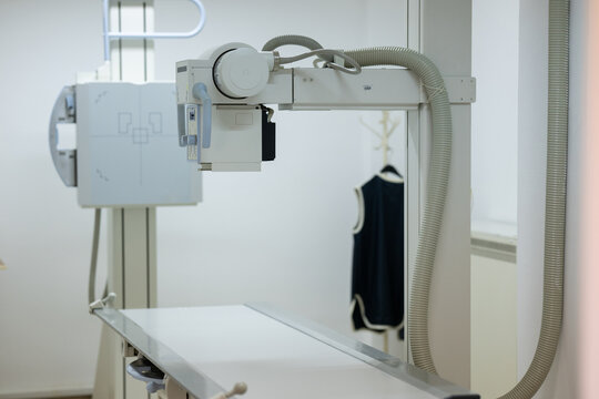 Modern X-ray machine in a medical examination room.