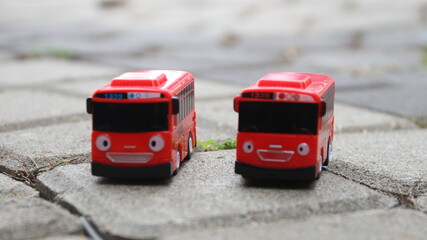 Red children's toy bus on a white background. stock photos