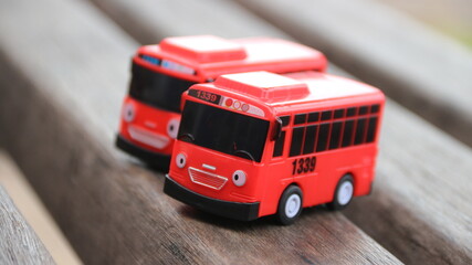 Red children's toy bus on a white background. stock photos