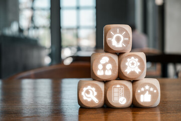 Wooden blocks with icons symbolizing expert advice, showcasing knowledge and professional guidance...