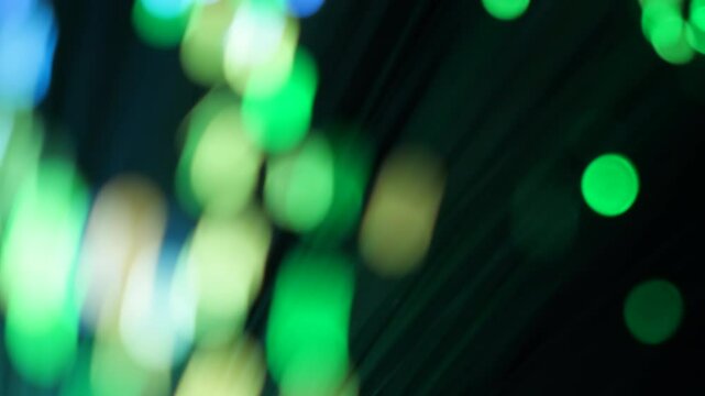 Energetic abstract composition features streaks of neon green light flowing dynamically over a deep black background, creating a sense of swift movement.