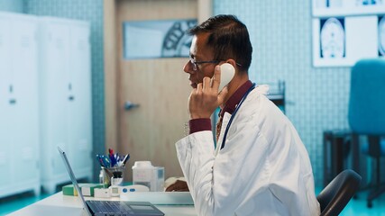 Male physician examining x ray test results in his medical cabinet, providing a diagnostic for a sick patient. Doctor studying hospital records and sharing his expertise in the industry. Camera A.