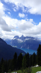 Obraz premium Karersee lake and the Latemar mountain group in a cloudy day, Dolomites. with white shades