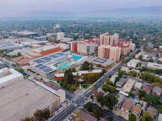 Aerial view of San Jose State University SJSU in California, USA. The photo shows the campus buildings, swimming pool, and surrounding neighborhood.
